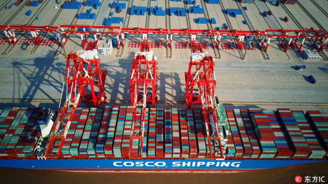 An aerial view of containers at the fourth phase of the Yangshan Deep Water Port, the world's largest automated cargo wharf, in Shanghai, China, on December 6, 2017. [File photo: IC]