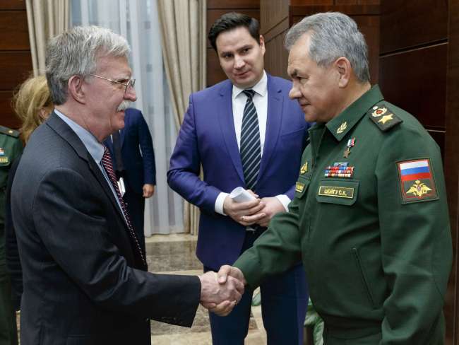 U.S. National Security Adviser John Bolton, left, and Russian Defense Minister Sergei Shoigu shake hands during their meeting in Moscow, Russia, Tuesday, Oct. 23, 2018.[Photo:AP]