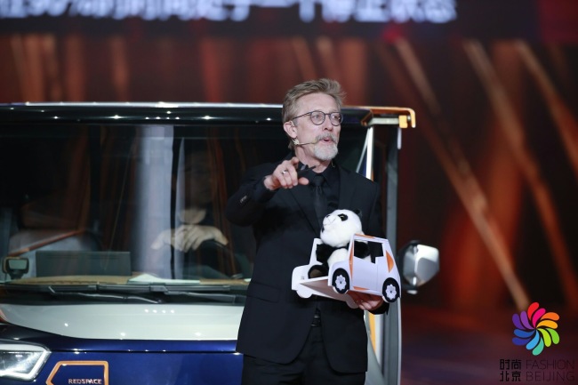 World-famous car designer Chris Bangle promotes the REDSPACE electric car at a fashion event titled "Night of Fashion Beijing" on Friday, Oct 26, 2018. [Photo provided to China Plus]