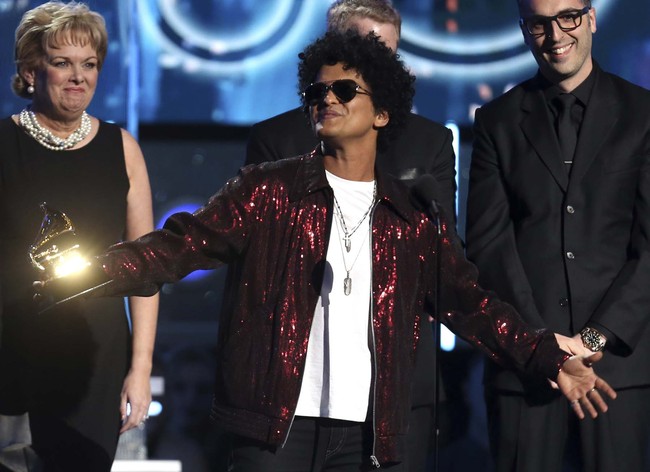 In this Jan. 28, 2018 file photo, Bruno Mars accepts the award for record of the year for "24K Magic" at the 60th annual Grammy Awards in New York. The Grammy Awards are extending the number of nominees in its top categories from five to eight. [Photo: AP]