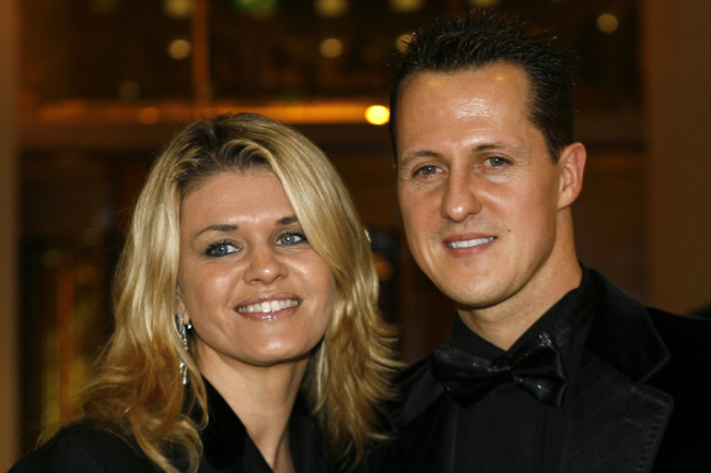 Formula one champion Michael Schumacher of Germany poses with his wife Corinna at the 2006 FIA Awards Ceremony, in Monaco, Friday, Dec 8, 2006. [File photo: AP]