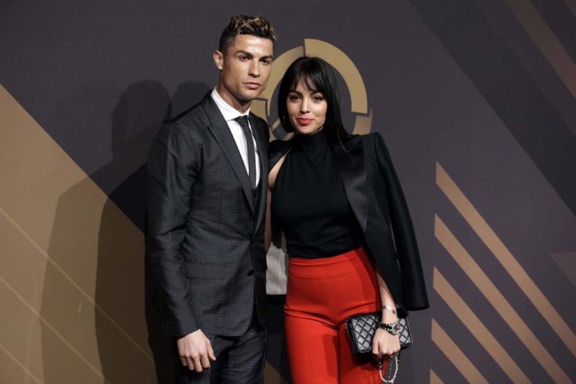 Real Madrid player Cristiano Ronaldo and his girlfriend Georgina Rodriguez pose for photos as they arrive for the Portuguese soccer federation awards ceremony Monday, March 19, 2018, in Lisbon. [Photo: AP]