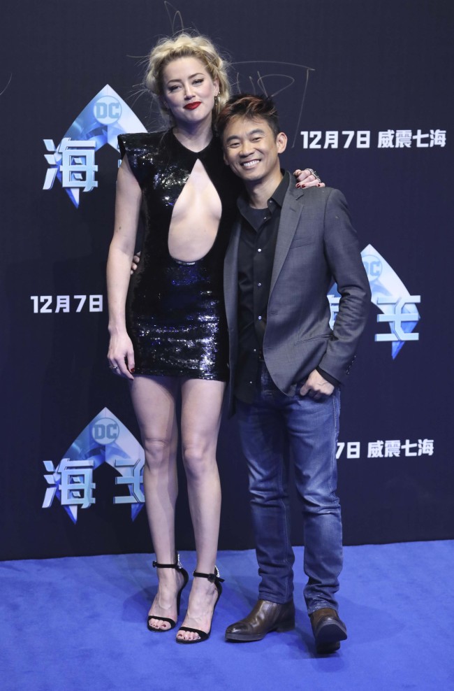 Actress Amber Heard and director James Wan pose for a photo during an event in Beijing, China, Sunday, Nov. 18, 2018, ahead of the Aquaman movie's December world premiere. [Photo: AP]