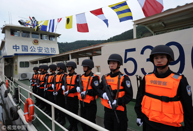 Chinese police officers on a patrol ship take part in a joint patrol operation along the Mekong River. [File photo: VCG]