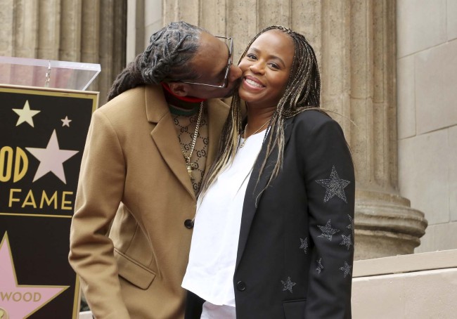 Rapper Snoop Dogg, right, kisses Shante Broadus following a ceremony honoring him with a star on the Hollywood Walk of Fame on Monday, Nov. 19, 2018, in Los Angeles. [Photo: AP]