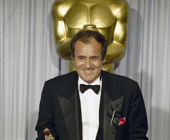 April 29, 1988 file photo of Italian Film director Bernardo Bertolucci after he won the Best Director award for his movie "The Last Emperor", at the Academy Awards, at the Shrine Civic Auditorium in Los Angeles. [File Photo: AP]