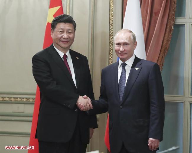 Chinese President Xi Jinping (L) meets with his Russian counterpart Vladimir Putin, in Buenos Aires, Argentina, Nov. 30, 2018.  [Photo: Xinhua] 