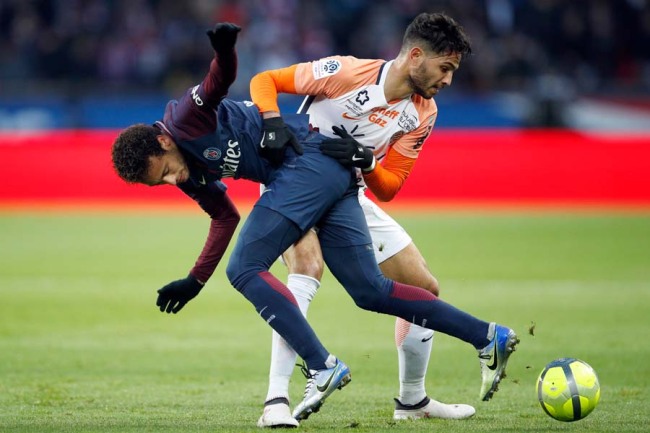 In this Jan.27, 2018 file photo, PSG's Neymar, left challenge with Montpellier's Pedro Felipe Teodosio Mendes during their French League One soccer match between Paris Saint Germain and Montpellier at the Parc des Princes stadium in Paris. [Photo: AP]