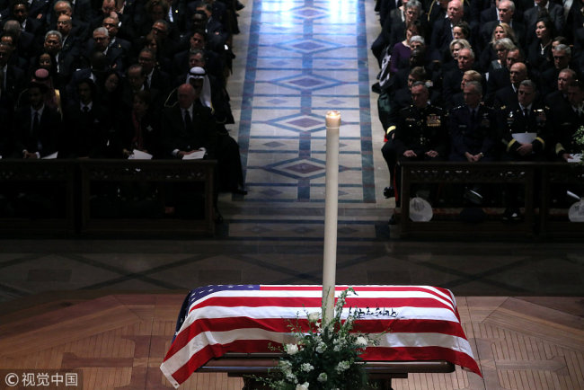 The Casket stands at the alter during the state funeral for former U.S. President George H.W. Bush at the Washington National Cathedral in Washington, U.S., December 5, 2018. [Photo: VCG]