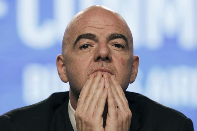 In this April 12, 2018 file photo, FIFA President Gianni Infantino participates in the annual conference of the South American Football Confederation, CONMEBOL, in Buenos Aires, Argentina. Infantino has asked the emir of Qatar to consider co-hosting the next World Cup with several nations that are attempting to isolate the tiny desert country in a bitter diplomatic dispute. Qatar has just eight stadiums to host 64 games over an already-congested 28-day window in 2022. Expanding the field to 48 teams would mean 80 games, requiring more stadiums. Infantino says using venues in Saudi Arabia and around the Persian Gulf “would probably be a nice message.” [Photo: AP]