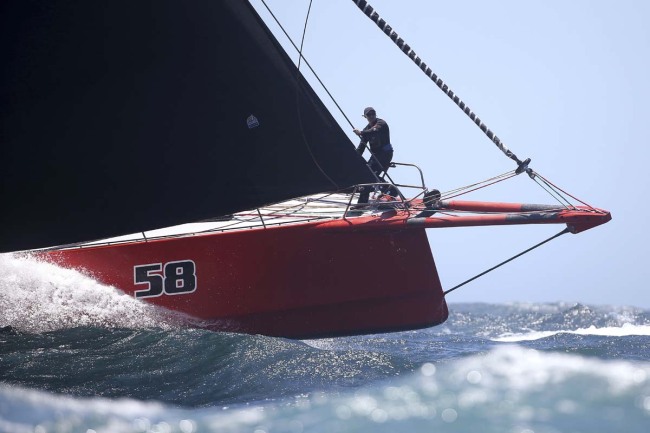 The bowman of Comanche directs his helmsman during the start of the Sydney Hobart yacht race in Sydney, Wednesday, Dec. 26, 2018. The 630-nautical mile race has 85 yachts starting in the race to the island state of Tasmania. [Photo: AP]