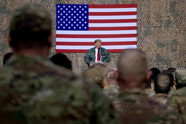 U.S. President Donald Trump speaks at a hanger rally at Al Asad Air Base, Iraq, Wednesday, Dec. 26, 2018. [Photo: AP/Andrew Harnik]