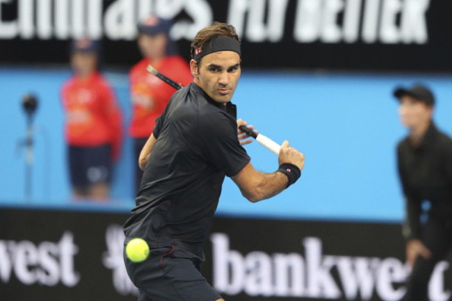 Switzerland's Roger Federer plays a shot during his match against at Frances Tiafoe of the United States at the Hopman Cup in Perth, Australia, Tuesday, Jan. 1, 2019. [Photo: AP]