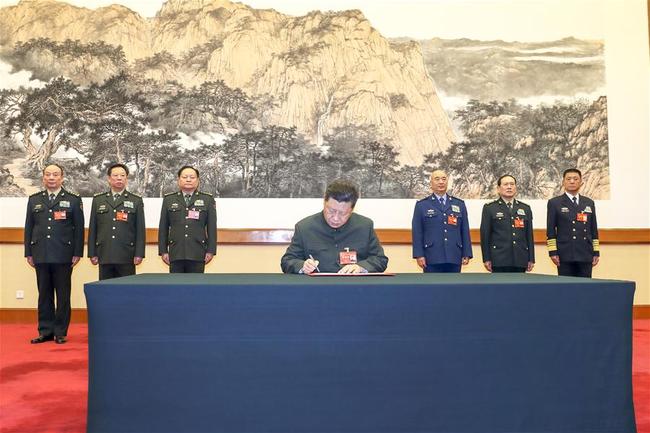 Chinese President Xi Jinping, also general secretary of the Communist Party of China (CPC) Central Committee and chairman of the Central Military Commission (CMC), signs a mobilization order for the training of the armed forces, the CMC's first order in 2019, at a CMC meeting held in Beijing, capital of China, Jan. 4, 2019. [Photo: Xinhua/Li Gang]