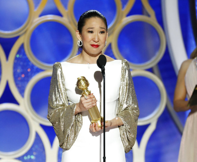 This image released by NBC shows Sandra Oh accepting the award for best actress in a drama series for her role in "Killing Eve" during the 76th Annual Golden Globe Awards at the Beverly Hilton Hotel on Sunday, Jan. 6, 2019 in Beverly Hills, Calif. [Photo: NBC via AP/Paul Drinkwater]