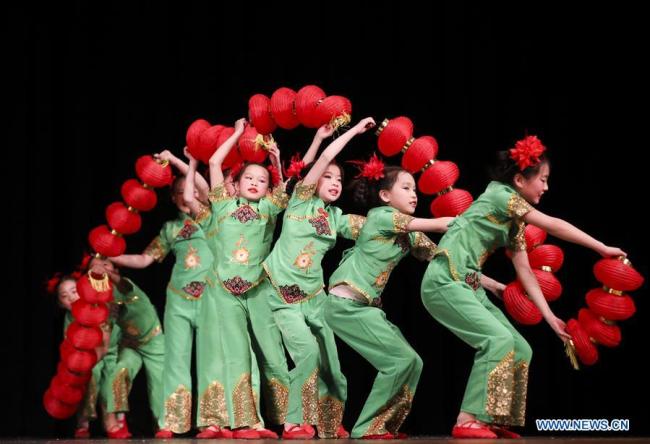 Students from the Great Wall Chinese School perform "Red Lantern," a folk dance of Chinese ethnic Han, during a New Year celebration organized by Greater Philadelphia Chinese School of Union (GPCSU) in Philadelphia, the United States, on Jan. 6, 2019. [Photo: Xinhua]