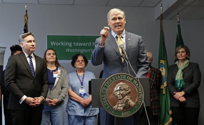 Washington Gov. Jay Inslee speaks Tuesday, Jan. 8, 2019, at a news conference in Seattle. Inslee, a likely Democratic presidential candidate, announced a proposal for a public health insurance option for Washington state residents, the latest action by a Democratic governor to address Trump administration health policies they say are keeping people from getting the care they need. [Photo: AP/Ted S. Warren]