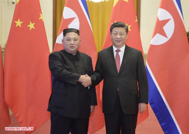 Xi Jinping (R), general secretary of the Central Committee of the Communist Party of China and Chinese president, holds a welcoming ceremony for Kim Jong Un, chairman of the Workers' Party of Korea and chairman of the State Affairs Commission of the Democratic People's Republic of Korea, before their talks at the Great Hall of the People in Beijing, capital of China, Jan. 8, 2019. Xi Jinping on Tuesday held talks with Kim Jong Un, who arrived in Beijing on the same day for a visit to China. [Photo: Xinhua]