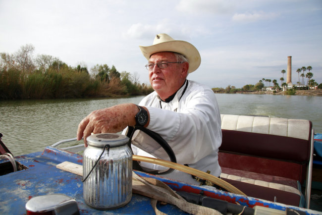 In this Tuesday, Jan. 8, 2019 photo, father Roy Snipes, pastor of the La Lomita Chapel, shows Associated Press journalists the land on either side of the Rio Grande at the US-Mexico border in Mission, Texas. Portions of Father Snipes' church land in Mission could be seized by the federal government to construct additional border wall and fence lines. Rather than surrender their land to the federal government, some property owners on the Texas border are digging in to fight President Donald Trump's border wall. They are rejecting buyout offers and preparing to battle the administration in court. Trump is scheduled to travel to the border Thursday to make the case for his $5.7 billion wall. [Photo: AP]