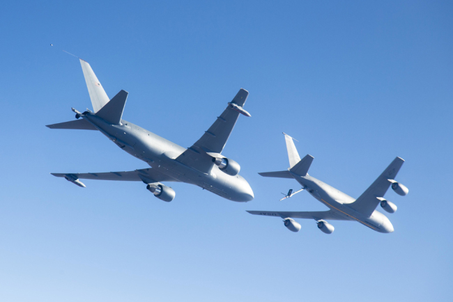 In this October 19, 2015 US Air Force photo, a Boeing KC-46A (L) conducts tests of aircraft acceleration and vibration exposure while flying in receiver formation at various speeds and altitudes over Edwards Air Force Base, California. The US Air Force on January 10, 2019, took delivery of its first KC-46A Pegasus tanker, though the new type of aerial refueler remains beset with technical problems and is not fully operational. [File Photo: Handout/US AIR FORCE/AFP]
