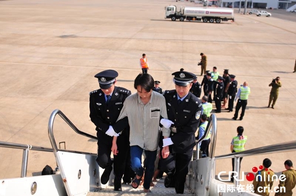 A telecom and Internet fraud suspect is brought back from Laos to central China's Henan Province on Friday, January 11, 2019. [Photo: cri.cn]
