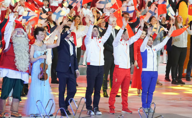 Chinese winter sports athletes and Finnish performers wave goodbye to audience at the end of the China-Finland Year of Winter Sports opening ceremony on Jan 15, 2019 in Beijing. [Photo: China Plus]