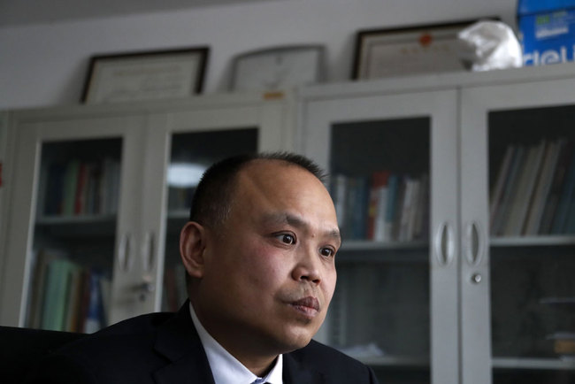 In this Feb. 24, 2017 photo, Chinese lawyer Yu Wensheng pauses during an interview at his office in Beijing. [File photo: AP/Andy Wong]