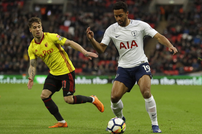 Tottenham's Mousa Dembele, right, competes for the ball with Watford's Kiko Femenia during the English Premier League soccer match between Tottenham Hotspur and Watford at Wembley stadium in London, Monday, April 30, 2018. [Photo: AP]