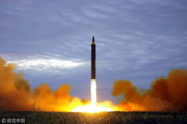 This picture from North Korea's official Korean Central News Agency (KCNA) taken on August 29, 2017 and released on August 30, 2017 shows North Korea's intermediate-range strategic ballistic rocket Hwasong-12 lifting off from the launching pad in Pyongyang. [File Photo: VCG]