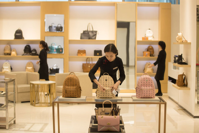 Salespersons work in a new duty-free shop in Haikou, capital of Hainan Province, on Friday, January 18, 2019, ahead of its opening on Saturday. [Photo: IC]