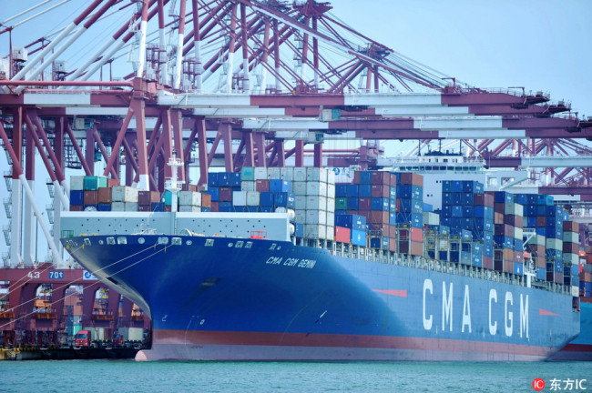 A cargo ship of CMA CGM Group loaded with containers to be shipped abroad berths on a quay at the Port of Qingdao in Qingdao city, east China's Shandong province, 6 July 2018.[File Photo: IC]