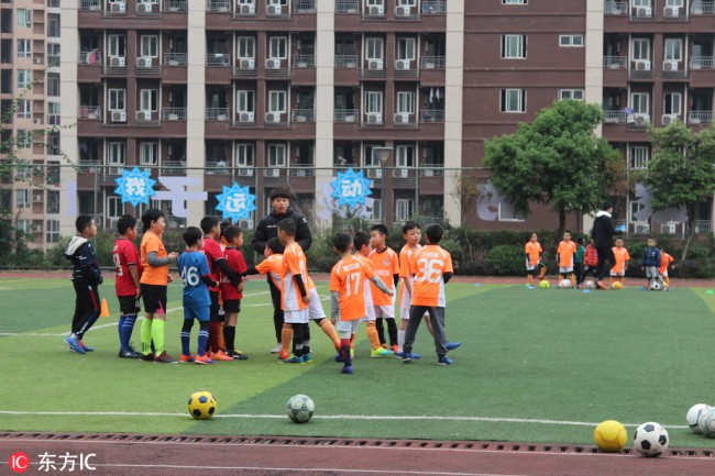 Elementary student take football class at a school in central China’s Chongqing Musicality, January 1, 2019. [Photo: IC]