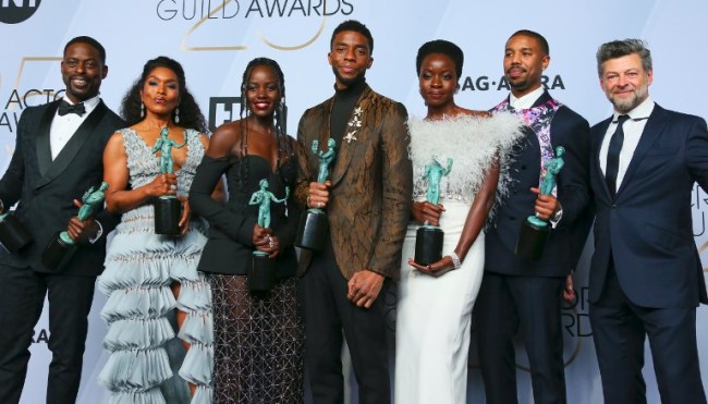 (L-R) Sterling K. Brown, Angela Bassett, Lupita Nyong'o, Chadwick Boseman, Danain Gurira, Michael B. Jordan and Andy Sirkis winners of Outstanding Performance by a Cast in a Motion Picture for "Black Panther" pose in the press room during the 25th Annual Screen Actors Guild Awards at the Shrine Auditorium in Los Angeles on January 27, 2019. [Photo: Jean-Baptiste LACROIX / AFP] 