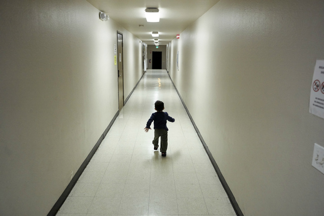 FILE - In this Dec. 11, 2018 file photo, an asylum-seeking boy from Central America runs down a hallway after arriving from an immigration detention center to a shelter in San Diego. The Trump administration says it would require extraordinary effort to reunite what may be thousands of migrant children who were separated from their parents and, even if it could, the children would likely be emotionally harmed. An official says removing children from "sponsor" homes to rejoin their parents "could be traumatic." [Photo: AP/Gregory Bull]