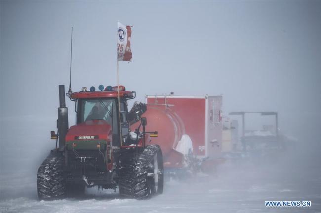 The Kunlun team and the Taishan team of China's 35th Antarctic expedition move amid a blizzard in Antarctica, Feb. 3, 2019. The Kunlun team and the Taishan team of China's 35th Antarctic expedition left the Taishan Station for Zhongshan Station, which is some 520 kilometers away. They are expected to reach the destination on Feb. 8. [Photo: Xinhua/Liu Shiping]
