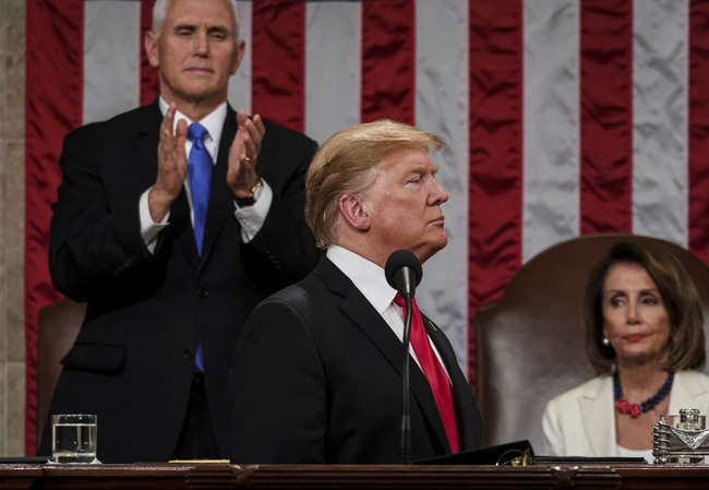 President Donald Trump gives his State of the Union address to a joint session of Congress, Tuesday, Feb. 5, 2019 at the Capitol in Washington, as Vice President Mike Pence, left, and House Speaker Nancy Pelosi look on. [Photo: AP]