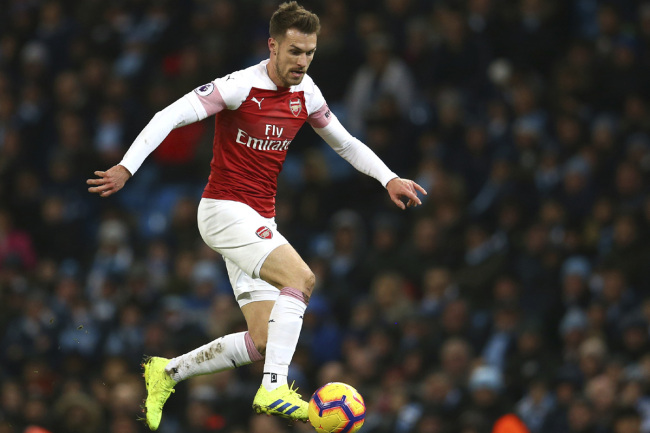 Arsenal's Aaron Ramsey controls the ball during the English Premier League soccer match between Manchester City and Arsenal at Etihad stadium in Manchester, England, Sunday, Feb. 3, 2019. [Photo: AP]
