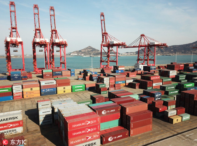 Stacks of containers to be shipped abroad at Lianyungang Port in Jiangsu Province. [Photo: IC]