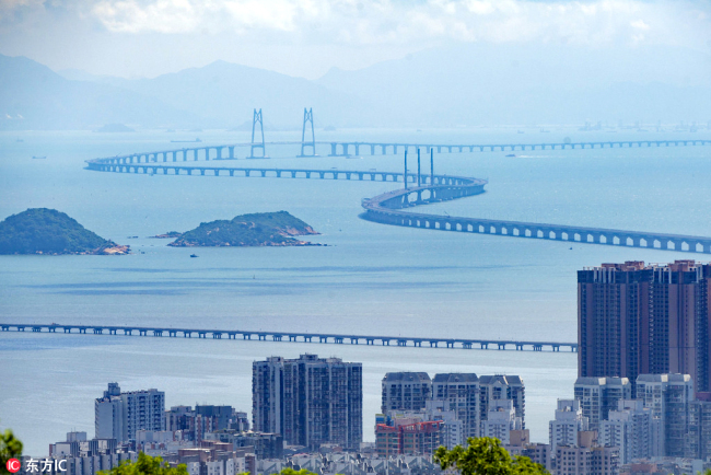 Photo taken on August 25, 2017 shows a view of the world's longest cross-sea bridge, the Hong Kong-Zhuhai-Macao Bridge, under construction against Hong Kong's Lantau Island in the background. [File Photo: IC]