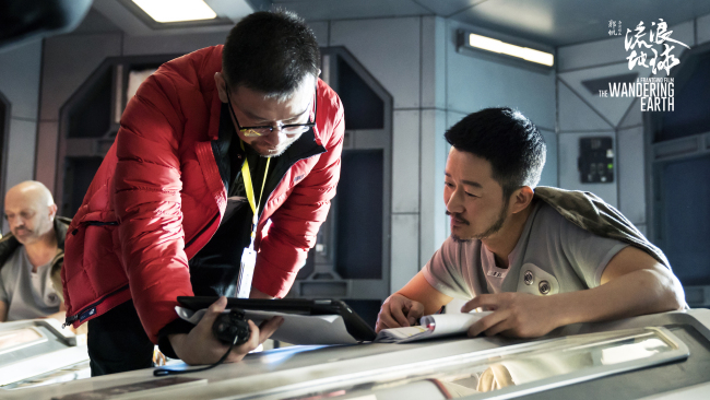 Wu Jing speaks with Guo Fang, director of "The Wandering Earth."[Photo provided to China Plus]