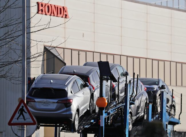 Honda cars leave the Honda car factory in Swindon, England, Tuesday, Feb. 19, 2019. The Japanese carmaker Honda announced Tuesday that its car plant in Swindon will close with the potential loss of some 3,500 jobs. [Photo: AP/Frank Augstein]