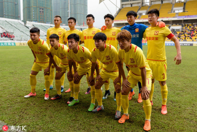 The starting 11 players of Sichuan Jiuniu FC pose for photo ahead of league game against Yanbian in Chengdu on Oct 13, 2018. [File photo: IC]