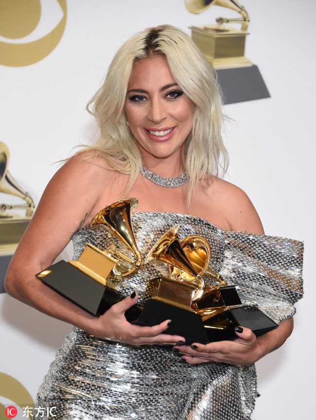 Lady Gaga appears backstage with her awards for Best Song Written for Visual Media for 'Shallow,' Best Pop Duo Group Performance with Bradley Cooper, and Best Pop Solo Performance for 'Joanne (Where Do You Think You're Goin'?' during the 61st annual Grammy Awards held at Staples Center in Los Angeles on February 10, 2019. [Photo：IC]