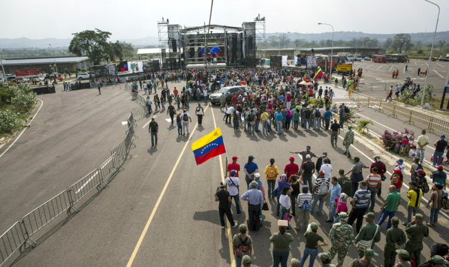 Government supporters gather during the first day of the "Hands off Venezuela" three-day music festival at the Tienditas International Bridge, in Urena, Venezuela, Feb. 22, 2019, on the border with Colombia. [Photo: AP/Rodrigo Abd]