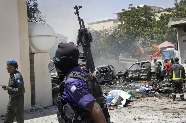 Security forces and emergency services attend the scene of a blast in the capital Mogadishu, Somalia, Tuesday Jan. 29, 2019. The blast took place inside a petrol station located near to the Ministry of Petroleum. [Photo: AP]