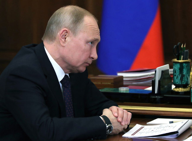 Russian President Vladimir Putin listens during a meeting in the Kremlin in Moscow, Russia, Monday, Feb. 25, 2019. [Photo: Sputnik, Kremlin Pool Photo via AP/Mikhail Klimentyev]