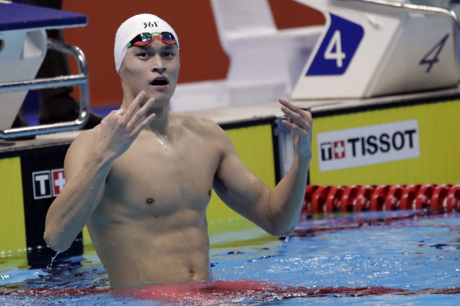 China's Sun Yang reacts after winning the men's 1500m freestyle final during the swimming competition at the 18th Asian Games in Jakarta, Indonesia, Friday, Aug. 24, 2018. [File photo: AP] 