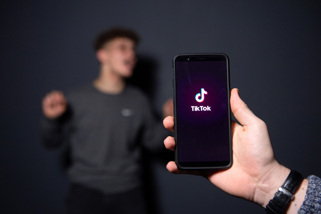 An man poses for a picture using the smart phone application TikTok on December 14, 2018 in Paris. [Photo: AFP]