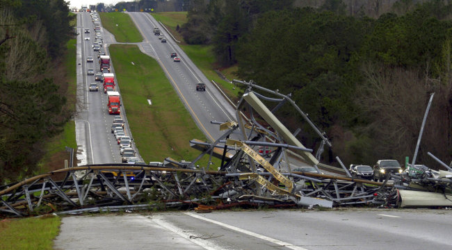 A fallen cell tower lies across U.S. Route 280 highway in Lee County, Ala., in the Smiths Station community after what appeared to be a tornado struck in the area Sunday, March 3, 2019. [Photo: AP Mike Haskey/Ledger-Enquirer]