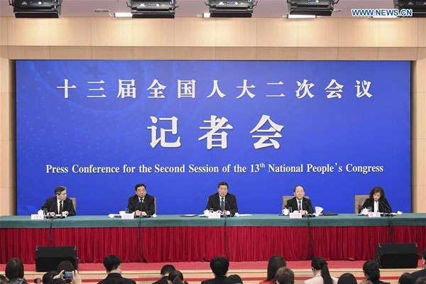 He Lifeng (C), head of the National Development and Reform Commission, Ning Jizhe (2nd R) and Lian Weiliang (2nd L), both deputy heads of the commission, attend a press conference on advancing the high-quality development of China's economy for the second session of the 13th National People's Congress in Beijing, capital of China, March 6, 2019. [Photo: Xinhua/Zhai Jianlan]